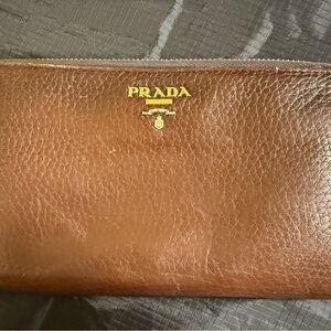 Prada Continental Leather Wallet with Gold Logo.